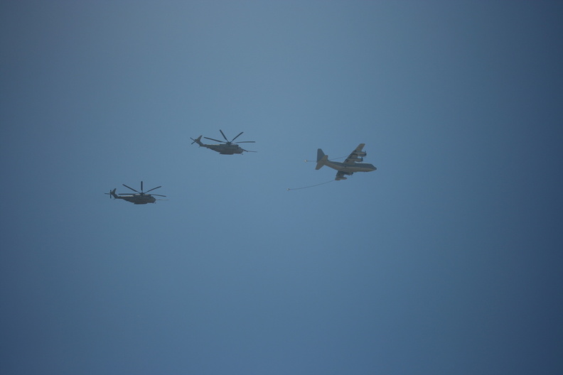 In-air refueling action with KC-130 and a pair of CH-53's